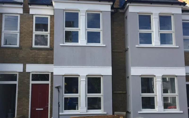 Freshly cleaned render on terraced houses in Wimbledon