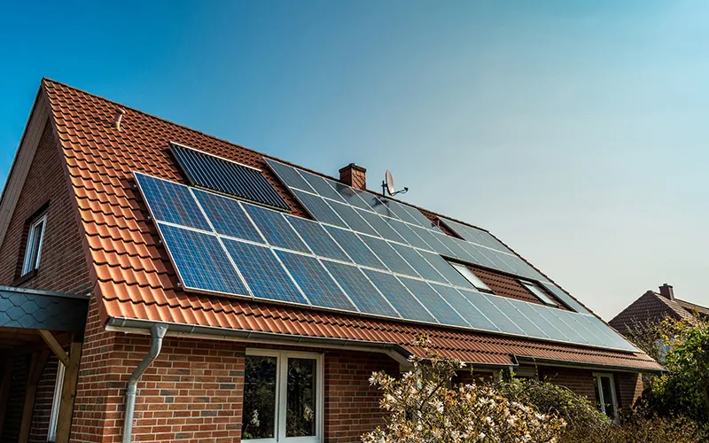Clean solar panels on a tiled house roof